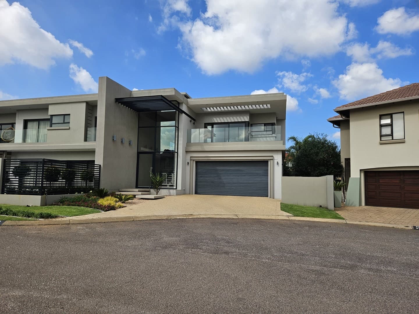 House with natural finish aluminium windows